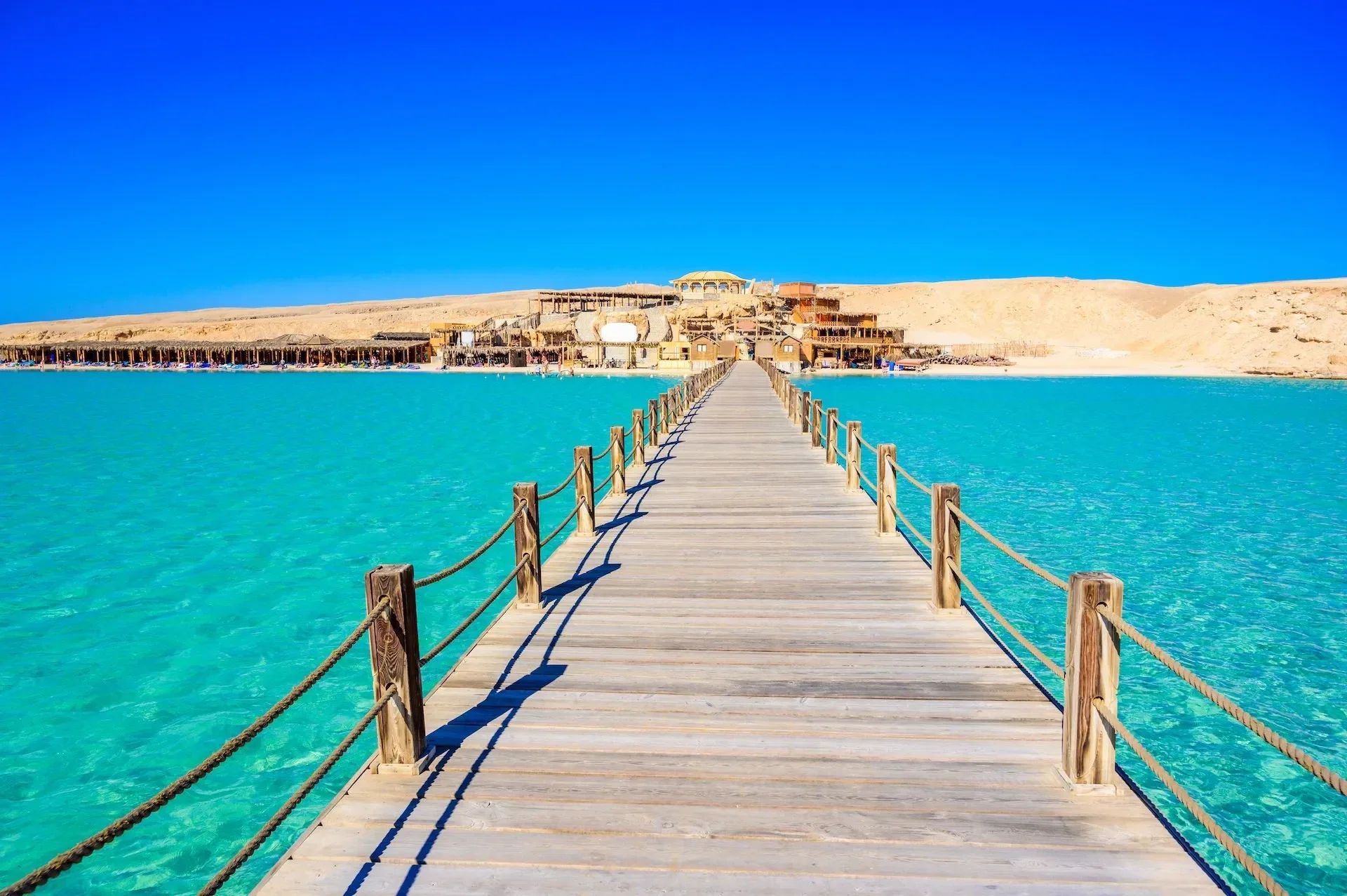 Wooden jetty leading to the turquoise Red Sea at Orange Bay, Hurghada