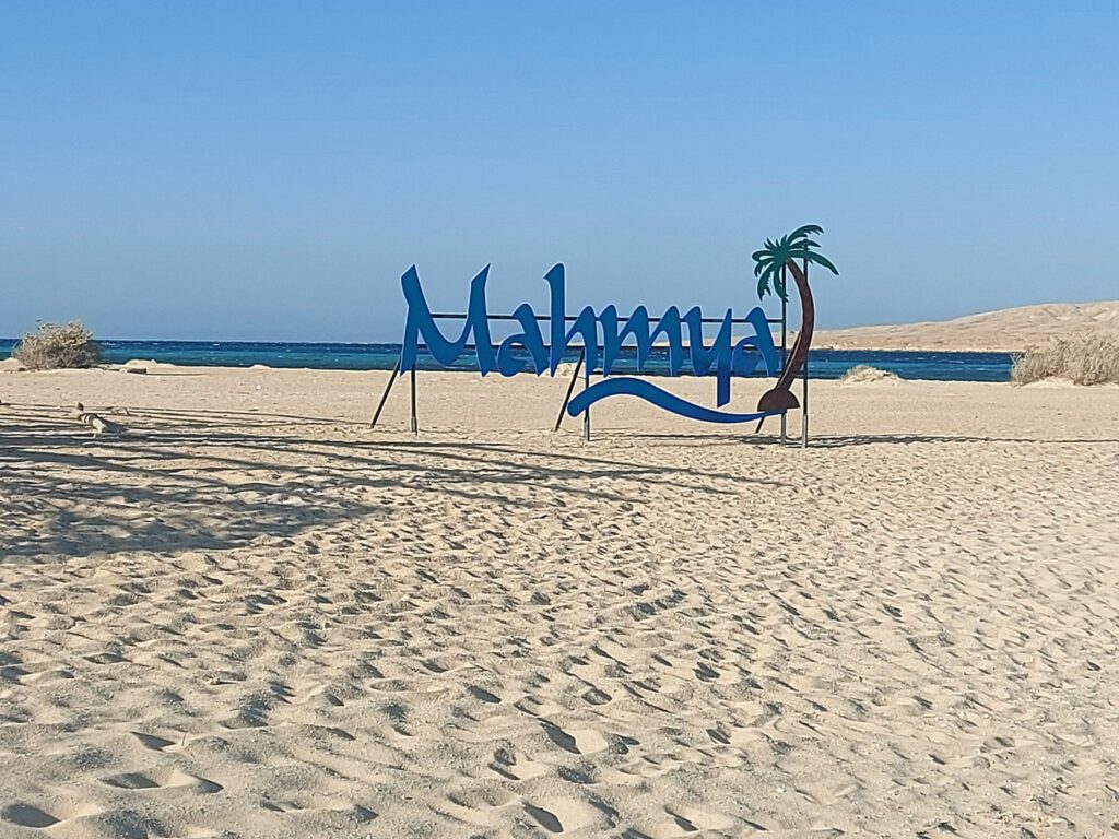 Mahmya Island sign on a white sandy beach near Hurghada